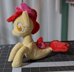 Size: 2148x2083 | Tagged: safe, artist:plushbyanto, apple bloom, seapony (g4), beanie (plushie), bow, chibi, female, filly, fins, irl, lying down, no mouth, no nostrils, no pupils, photo, plushie, profile, race swap, seaponified, seapony apple bloom, solo, species swap, tail fin, toy