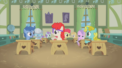 Size: 2880x1618 | Tagged: safe, screencap, apple bloom, archer (character), diamond tiara, liza doolots, noi, petunia, scootablue, silver spoon, sun glimmer, tootsie flute, twist, earth pony, pegasus, pony, unicorn, call of the cutie, background pony, classroom, desk, female, filly, foal, ponyville schoolhouse