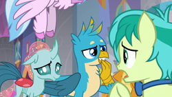 Size: 1280x720 | Tagged: safe, screencap, gallus, ocellus, sandbar, silverstream, smolder, changedling, changeling, classical hippogriff, dragon, hippogriff, she's all yak, amused, bowtie, claws, confused, curved horn, dragoness, female, flapping, folded wings, grin, hand over mouth, hooves, horn, male, offscreen character, open mouth, raised arm, raised eyebrow, raised hoof, smiling, smirk, spread wings, talking, talons, teenaged dragon, teenager, trio focus, unshorn fetlocks, wings
