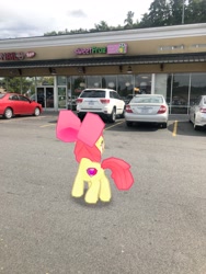 Size: 3024x4032 | Tagged: safe, photographer:undeadponysoldier, apple bloom, earth pony, pony, augmented reality, building, car, cutie mark, female, filly, gameloft, irl, parking lot, photo, ponies in real life, solo, sweet frog, the cmc's cutie marks