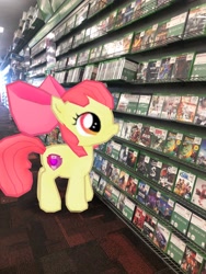 Size: 3024x4032 | Tagged: safe, photographer:undeadponysoldier, apple bloom, earth pony, pony, augmented reality, female, filly, gameloft, gamestop, irl, photo, ponies in real life, solo, united states, xbox one