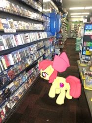 Size: 3024x4032 | Tagged: safe, photographer:undeadponysoldier, apple bloom, earth pony, pony, augmented reality, female, filly, gameloft, gamestop, irl, photo, playstation 4, ponies in real life