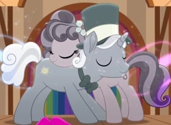 Size: 1002x729 | Tagged: safe, screencap, petunia petals, sunny skies, earth pony, pony, unicorn, rainbow roadtrip, bowtie, cropped, eyes closed, female, flower, flower in hair, hat, hug, love, male, mare, marriage proposal, petuniasky, shipping, smiling, stallion, straight