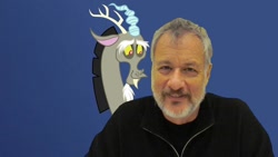 Size: 1024x576 | Tagged: safe, discord, draconequus, human, irl, irl human, john de lancie, male, photo, smiling, tribute, voice actor, voice actor joke