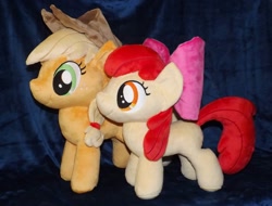 Size: 1280x974 | Tagged: safe, artist:peruserofpieces, derpibooru import, apple bloom, applejack, earth pony, pony, accessory, bow, comparison, cowboy hat, duo, female, filly, happy, hat, irl, mare, photo, plushie, profile, siblings, side by side, sisters, smiling, toy