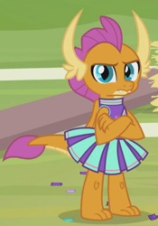 Size: 476x680 | Tagged: safe, screencap, smolder, dragon, 2 4 6 greaaat, cheerleader, cheerleader outfit, cheerleader smolder, claws, clothes, confetti, crossed arms, cute, cute when angry, displeased, dragoness, female, folded wings, frown, horns, kid, looking at you, skirt, slit eyes, smolder is not amused, smolderbetes, solo, teenaged dragon, teenager, toes, unamused, upset