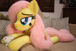 Size: 1024x683 | Tagged: safe, artist:ponimalion, fluttershy, pegasus, pony, bed, life size, pet, plushie