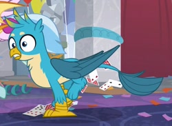 Size: 863x630 | Tagged: safe, screencap, gallus, silverstream, smolder, she's all yak, chest fluff, cropped, male, offscreen character, out of context, paws, playing card, tail, wings