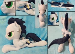 Size: 1024x741 | Tagged: safe, artist:whirlwindflux, soarin', pegasus, pony, folded wings, irl, male, photo, plushie, prone, solo, stallion, wings