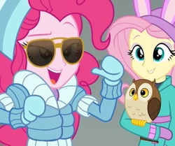 Size: 474x397 | Tagged: safe, screencap, fluttershy, pinkie pie, bird, owl, better together, equestria girls, holidays unwrapped, cap, chad (owl), clothes, cropped, gloves, hat, jacket, smiling, sunglasses