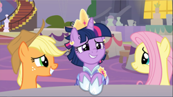 Size: 1667x940 | Tagged: safe, derpibooru import, screencap, applejack, fluttershy, twilight sparkle, twilight sparkle (alicorn), alicorn, earth pony, pegasus, pony, the last problem, cropped, crown, female, freckles, happy, jewelry, looking at each other, mare, regalia, second coronation dress, sitting, smiling, trio