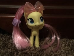 Size: 3264x2448 | Tagged: safe, fluttershy, pegasus, pony, my little pony: pony life, accessories, bow, cute, female, hairpin, irl, mare, photo, picture, shyabetes, solo, toy, unshorn fetlocks, wings