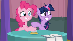 Size: 1668x940 | Tagged: safe, derpibooru import, screencap, pinkie pie, twilight sparkle, twilight sparkle (alicorn), alicorn, earth pony, pony, a trivial pursuit, bell, cropped, cute, diapinkes, duo, female, grin, mare, messy mane, sitting, smiling, table, twiabetes