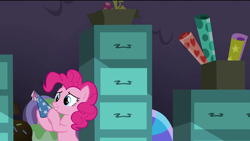 Size: 1920x1080 | Tagged: safe, derpibooru import, screencap, pinkie pie, earth pony, pony, the last problem, box, female, file, file cabinet, happy, hat, mare, party cave, party hat, smiling, solo, wrapping paper