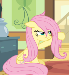 Size: 682x744 | Tagged: safe, derpibooru import, screencap, fluttershy, pegasus, pony, flutter brutter, cropped, female, floppy ears, fluttershy is not amused, mare, messy mane, narrowed eyes, sitting, solo, unamused