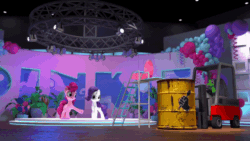 Size: 800x450 | Tagged: safe, derpibooru import, screencap, gummy, pinkie pie, rarity, earth pony, pony, unicorn, hello pinkie pie, 3d, animated, defying physics, food, forklift, gif, gotcha, headset, hiding, in which pinkie pie forgets how to gravity, oil drum, pinkie being pinkie, pinkie physics, pudding, running, shocked, stage, stagelights, stepladder, surprised