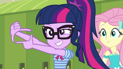 Size: 1920x1080 | Tagged: safe, derpibooru import, screencap, fluttershy, sci-twi, twilight sparkle, better together, equestria girls, holidays unwrapped, canterlot high, duo, duo female, female, geode of fauna, glasses, hallway, lockers, magical geodes, o come all ye squashful, ponytail, smiling