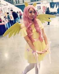 Size: 717x897 | Tagged: safe, derpibooru import, fluttershy, human, clothes, cosplay, costume, cutie mark, cutie mark on clothes, dress, female, irl, irl human, photo, wings