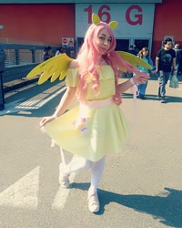 Size: 1080x1350 | Tagged: safe, derpibooru import, fluttershy, human, clothes, cosplay, costume, cutie mark, cutie mark on clothes, dress, female, irl, irl human, photo, wings