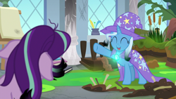 Size: 800x450 | Tagged: safe, artist:disneymarvel96, derpibooru import, edit, edited screencap, editor:disneymarvel96, screencap, starlight glimmer, trixie, pony, unicorn, a horse shoe-in, brooch, cape, clasp, clothes, duo, glow, hat, trixie's cape, trixie's glowing brooch, trixie's hat