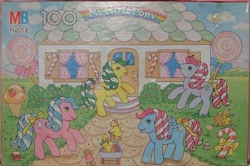 Size: 616x410 | Tagged: safe, photographer:wickedwonderland, molasses, bird, duck, g1, bow, candy, candy cane, candy cane pony, caramel crunch, food, gingerbread man, house, ice cream cone, lemon treats, lollipop, milton bradley, mint dreams, official, puzzle, tail bow