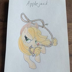 Size: 941x941 | Tagged: safe, alternate version, artist:_liz_art_, derpibooru import, applejack, earth pony, pony, female, freckles, hat, irl, lasso, mare, photo, rope, smiling, solo, text, traditional art