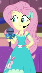 Size: 338x587 | Tagged: safe, screencap, fluttershy, best in show: the victory lap, better together, equestria girls, cropped, cute, hand on hip, microphone, shyabetes, smiling, solo