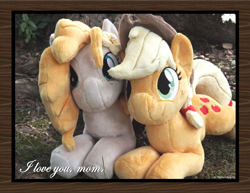 Size: 1650x1275 | Tagged: safe, artist:peruserofpieces, derpibooru import, applejack, pear butter, earth pony, beanie (plushie), female, irl, looking at you, mare, mother and child, mother and daughter, parent and child, photo, plushie, prone