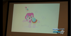 Size: 1366x704 | Tagged: safe, artist:cooltomorrowkid, artist:ellybethe, derpibooru import, pinkie pie, earth pony, pony, alternate hairstyle, bronycon, clothes, concept art, convention, dress, everfree network, female, journey of the spark, mare, photo, raised hoof, raised leg, signature, smiling