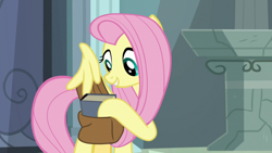 Size: 1920x1080 | Tagged: safe, derpibooru import, screencap, fluttershy, pegasus, pony, daring doubt, bag, book, saddle bag, solo, wing hands, wings