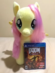 Size: 1536x2048 | Tagged: safe, derpibooru import, fluttershy, pegasus, pony, doom, doom eternal, looking at you, obligatory pony, plushie