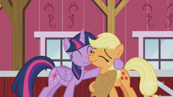 Size: 1280x720 | Tagged: safe, derpibooru import, screencap, applejack, twilight sparkle, twilight sparkle (alicorn), alicorn, earth pony, pony, harvesting memories, spoiler:harvesting memories, spoiler:mlp friendship is forever, 9now, applejack's hat, cowboy hat, cute, daaaaaaaaaaaw, duo, eyes closed, female, hat, hug, jackabetes, mare, smiling, sweet apple acres, sweet apple acres barn, twiabetes