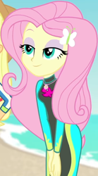 Size: 454x815 | Tagged: safe, screencap, applejack, fluttershy, butterfly, better together, equestria girls, forgotten friendship, beach, bodysuit, clothes, cropped, cute, female, geode of fauna, hairclip, hands together, jewelry, lidded eyes, long sleeves, magical geodes, necklace, ocean, sand, shyabetes, sky, smiling, swimsuit, wetsuit