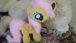 Size: 800x450 | Tagged: safe, artist:blackfreya, derpibooru import, fluttershy, pegasus, pony, eyelashes, female, heart eyes, irl, mare, photo, plushie, smiling, solo, wingding eyes