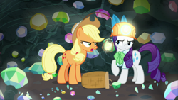 Size: 1920x1080 | Tagged: safe, derpibooru import, screencap, applejack, rarity, earth pony, pony, unicorn, dragon dropped, annoyed, ascot tie, basket, blouse, cave, clothes, duo, female, gem, gem cave, hard hat, headlamp, helmet, lantern, mare, mining helmet