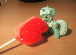 Size: 1760x1280 | Tagged: safe, artist:solrac31337, lyra heartstrings, hand, irl, lollipop, nom, photo, toy