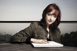 Size: 560x373 | Tagged: safe, derpibooru import, human, irl, irl human, lauren faust, notebook, photo, solo