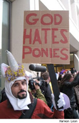 Size: 294x456 | Tagged: safe, human, troll, unicorn, barely pony related, cosplay, irl, irl human, photo, protest, sign