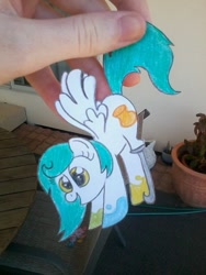 Size: 720x960 | Tagged: safe, artist:partylikeanartist, oc, oc only, oc:chroma feather, pegasus, pony, amputee, hand, hanging, paper child, paper pony, papercraft, photo, prosthetic limb, solo, traditional art
