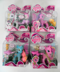 Size: 800x955 | Tagged: safe, derpibooru import, blossomforth, cupcake (g4), dewdrop dazzle, lulu luck, brushable, choking hazard, cr, cr is a duck, pony pulls the wagon, sugarcup, toy