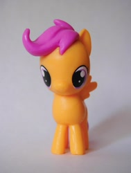 Size: 1211x1600 | Tagged: safe, scootaloo, pegasus, female, figure, filly, orange coat, purple mane, solo, toy