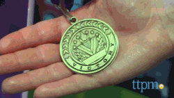 Size: 640x360 | Tagged: safe, equestria girls, friendship games, animated, hand, medal, merchandise, toy, toy fair, toy fair 2015