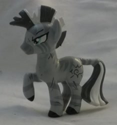 Size: 1725x1845 | Tagged: safe, artist:gryphyn-bloodheart, oc, oc only, oc:xenith, zebra, fallout equestria, blind bag, custom, fanfic, female, irl, mare, photo, raised hoof, solo, toy, zebra oc