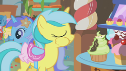 Size: 1280x720 | Tagged: safe, screencap, diamond mint, lemony gem, lightning bolt, white lightning, pegasus, pony, unicorn, call of the cutie, background pony, clothes, cupcake, eyes closed, female, flower, flower in hair, food, mare, puffy cheeks, saddle, skirt, tack