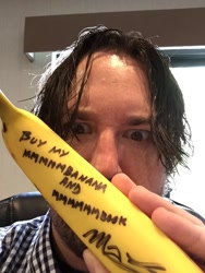 Size: 768x1024 | Tagged: safe, human, autograph, banana, buy my book, crazy eyes, crossing the memes, friendship is magic bitch, irl, irl human, larson you magnificent bastard, m.a. larson, meme, memeception, photo, trotcon 2015