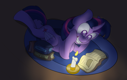 Size: 1400x890 | Tagged: safe, artist:vengefulstrudel, twilight sparkle, twilight sparkle (alicorn), alicorn, pony, book, candle, female, grin, mare, prone, reading, solo, that pony sure does love books