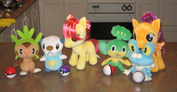 Size: 2749x1430 | Tagged: safe, artist:cheerbearsfan, apple bloom, scootaloo, chespin, froakie, irl, master ball, oshawott, pansage, photo, plushie, pokéball, pokémon