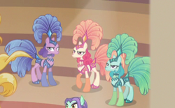 Size: 371x230 | Tagged: safe, derpibooru import, screencap, emerald flare, sapphire sequins, sunset circus, earth pony, pony, viva las pegasus, angry, background pony, cropped, female, mare, midriff, show mares, showgirl, unamused, zen moment