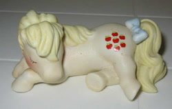 Size: 600x380 | Tagged: safe, derpibooru import, applejack (g1), g1, figurine, irl, merchandise, photo, porcelain, sleeping, solo