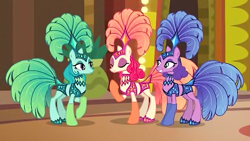 Size: 896x504 | Tagged: safe, edit, edited screencap, screencap, emerald flare, sapphire sequins, sunset circus, earth pony, pony, viva las pegasus, background pony, burlesque, clothes, costume, cropped, cute, eyes closed, female, headdress, las pegasus, mare, midriff, performer, raised hoof, show mares, showgirl, smiling